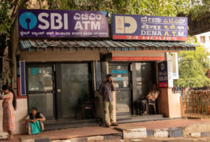 bangalore india june people sitting infront sbi atm dena bank s railway station 149955579